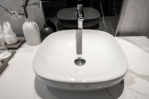 Modern luxury marble bathroom with sink, bathtub and mirror