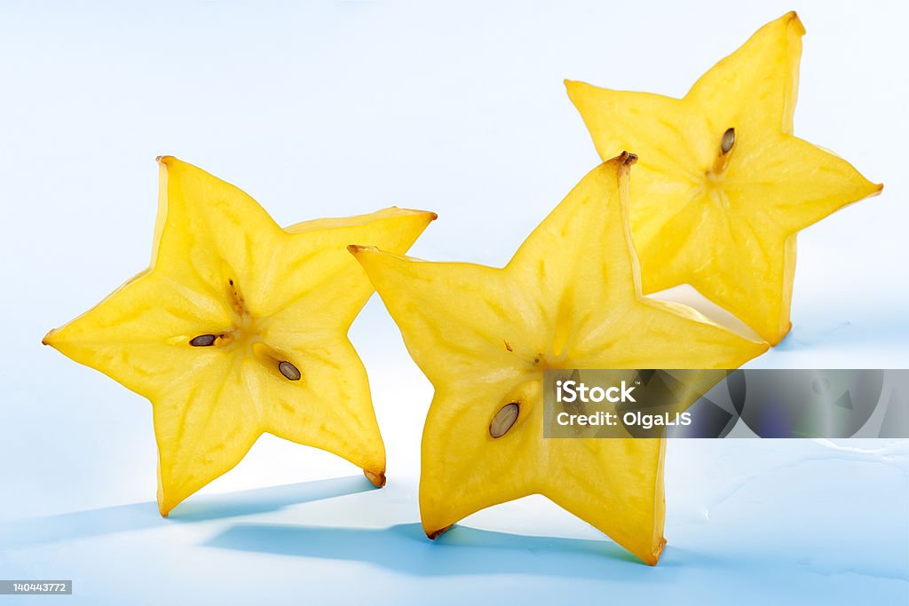 Frutti di carambola con fette di astrazione - Foto stock royalty-free di A forma di stella
