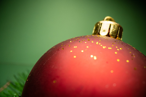 Shiny Christmas red ball and pine branches