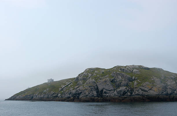 istock Island shrouded in fog 140443835
