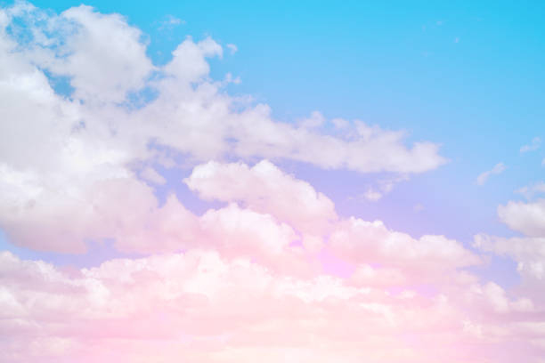istock Bright pink, summer clouds against the blue sky. 1404439283