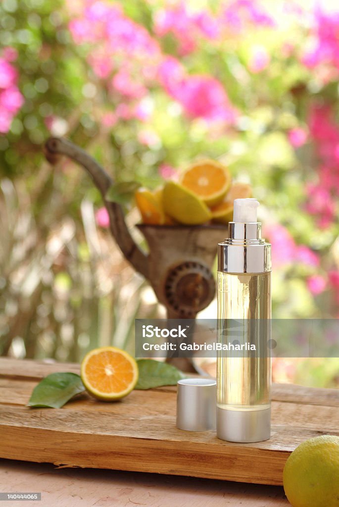 Wellness natural products Natural spa skin care product with old grinder and oranges. Alternative Medicine Stock Photo