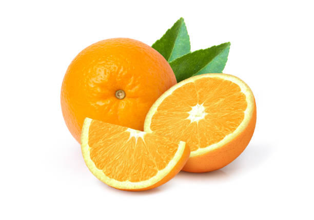 Orange fruit and half sliced with green leaf isolated stock photo