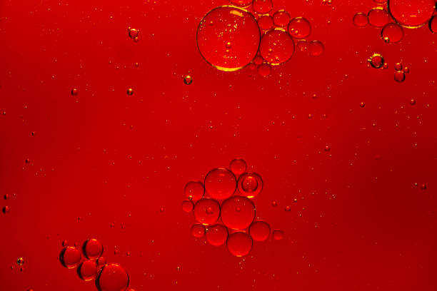 istock red macro bubbles,Backgrounds, Abstract Backgrounds, Soda, Red, Carbonated,Beauty concept background. Closeup cosmetic liquid gel with bubbles on red colors background 1404443627