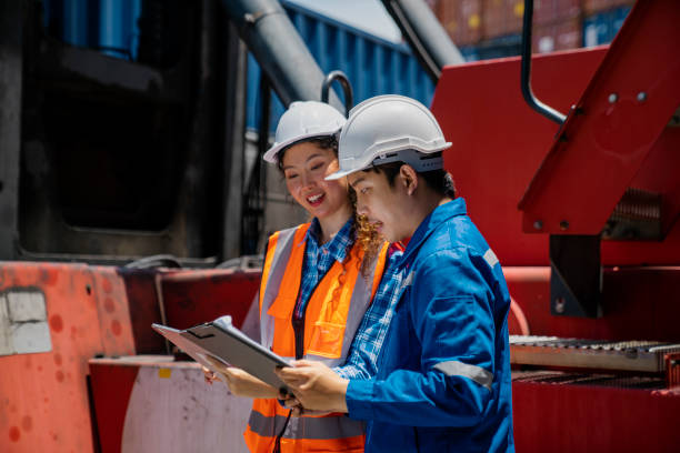 istock Engineer staff team checking and inspect container for international business logistic import and export concept. 1404444199