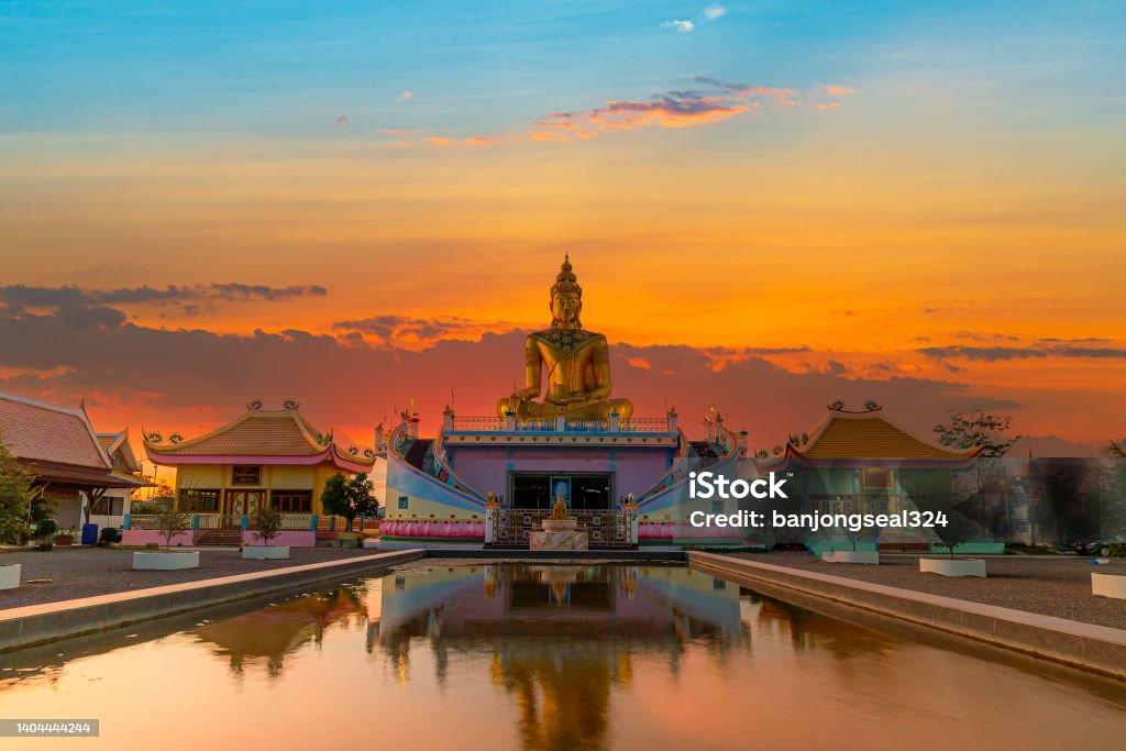 Buddha image,Golden buddha and beautiful sky,The Buddha With Beautiful Sunset Sky Background, Golden Buddha and Green Leaf, Buddha Background Phuket Stock Photo