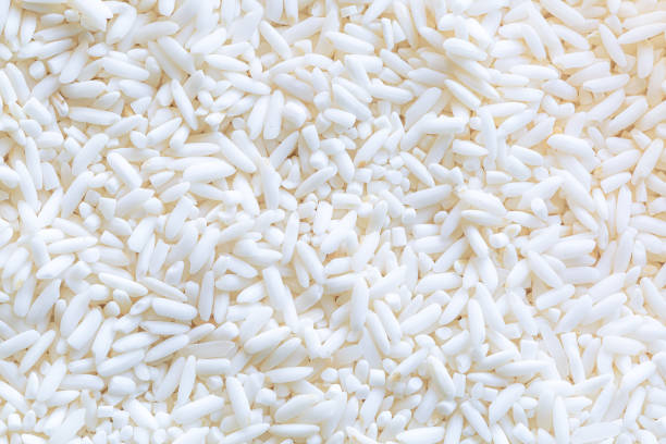 istock macro rice texture,Rice. Natural rice background and texture,Texture of rice with the bound pattern. 1404444316