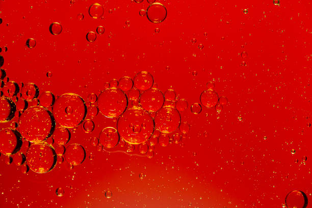 istock red macro bubbles,Backgrounds, Abstract Backgrounds, Soda, Red, Carbonated,Beauty concept background. Closeup cosmetic liquid gel with bubbles on red colors background 1404444417
