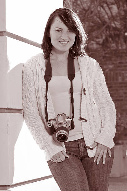 istock Girl with SLR photo camera 140444717