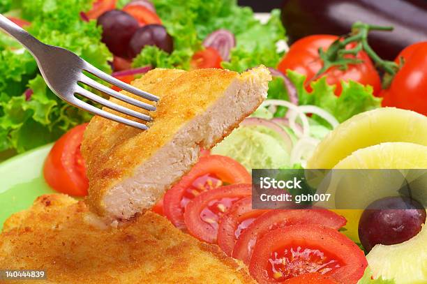 Fish Dinner With A Large Salad And Fruit Stock Photo - Download Image Now - Appetizer, Cooked, Crockery