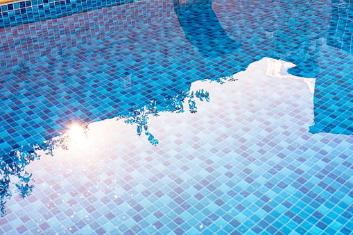 Vinyl lined pool. Outdoor photo of a mosaic-patterned residential swimming pool.