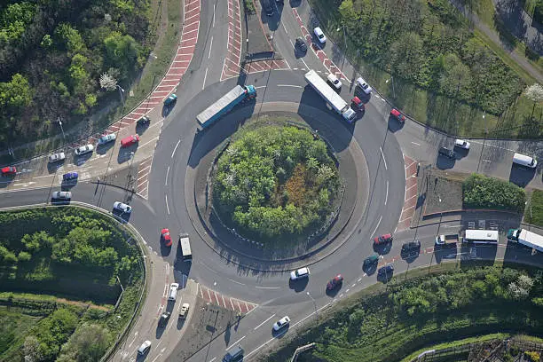 An aerial shot of a small but busy traffic island