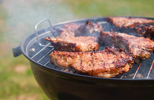 istock t-bone steak cooking on an open flame grill 140445648