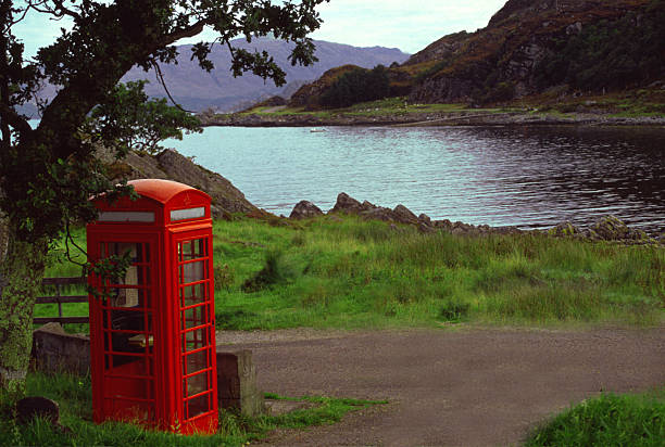 Red phone box in Scottish Highlands stock photo