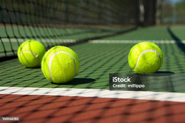 Tennis Balls On Court Stock Photo - Download Image Now - Exercising, Fault - Sports, Felt - Textile