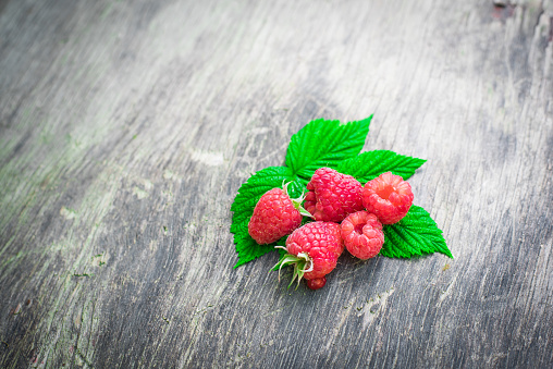 raspberries on a wooden background