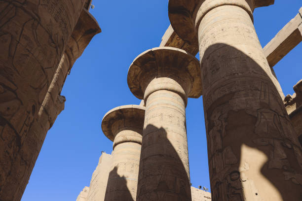 Luxor, Egypt - November 11, 2020: Ancient Massive Columns of Karnak Temple Complex in the Great Hypostyle Hall in the Precinct of Amun-Re