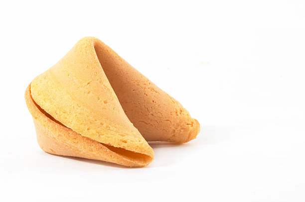 Close-up of a Chinese fortune cookie on a white background stock photo