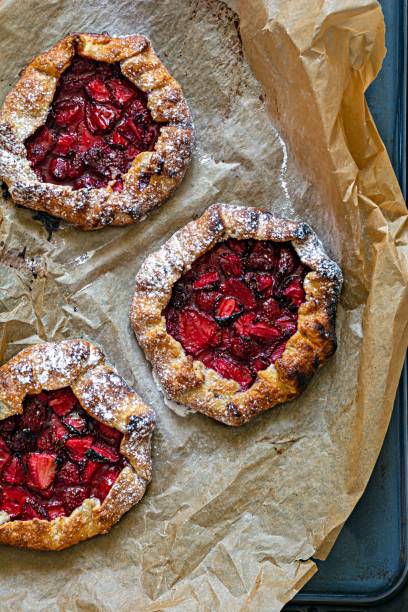 istock French dessert Galette with shortbread and strawberries. Open pie with berries. 1404468838