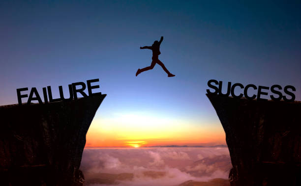 istock Go ahead and continuously improvement concept, silhouette man jump on a cliff from past to future 1404470500
