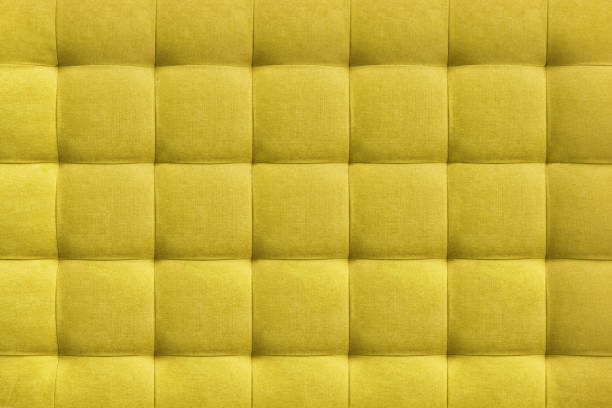 istock Yellow suede leather background, classic checkered pattern for furniture, wall, headboard 1404471240