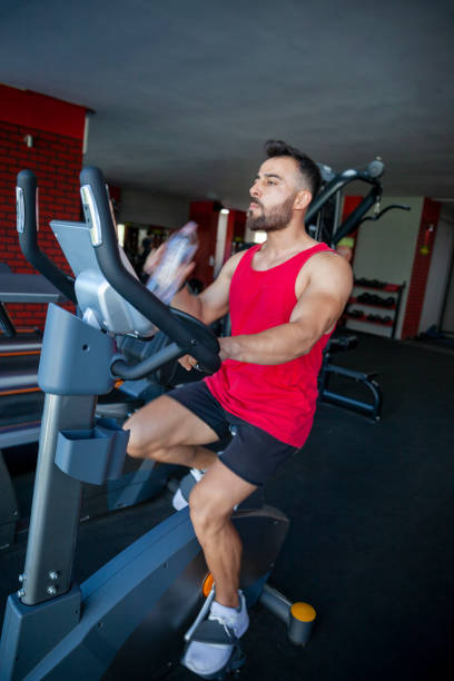 istock Young man at cycling exercise 1404471473