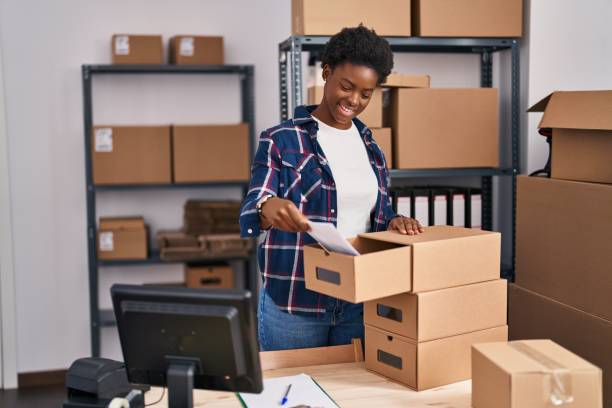 istock African american woman ecommerce business worker put document on drawer at office 1404471484
