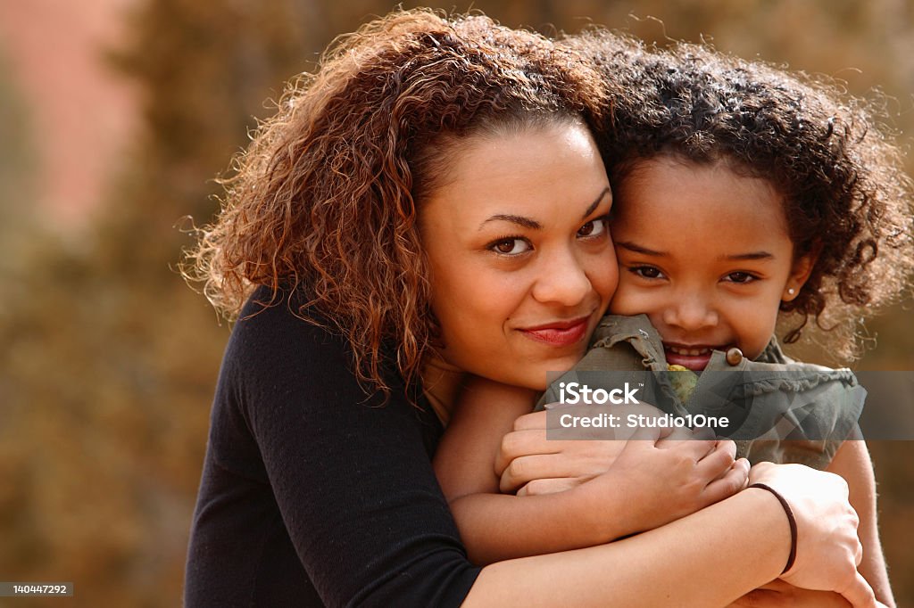 Mother hugging child on the mountains Hugs Colorado Stock Photo