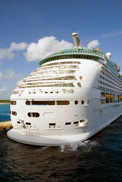 istock Luxury cruise ship in port against clouds and sky 140447405