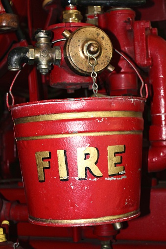 An antique firefighting bucket from a restored fire engine.