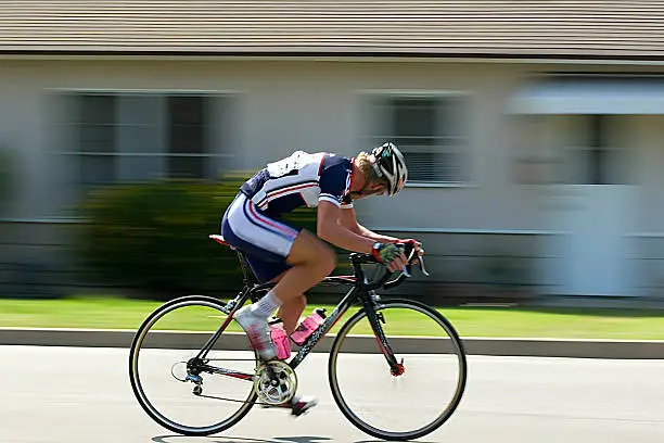 Panned shot of a cyclist during a bike race.