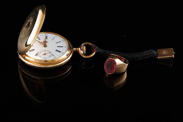 istock watch and golden ring 140447712