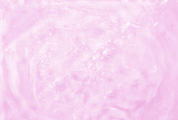 Pink gradient water background. Summer pink wave. Abstract or natural wavy water texture background. Defocus. The perfect backdrop for a presentation