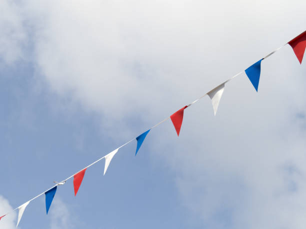 istock Photo of red white and blue triangular bunting on sky background. Queen's Jubilee 2022. 1404479721