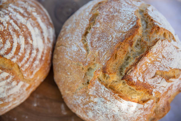 istock Loaves of bread on white background. 1404479861