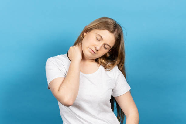 istock Young blonde woman suffering neckache 1404483852