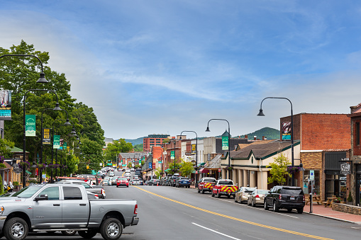 Boone, NC, USA-20 June 2022: Main Street in Summer. people, cars, businesses. Wide angle.
