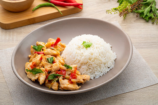 Cooked rice with stir-fried sliced chicken breast and basil.Thai food