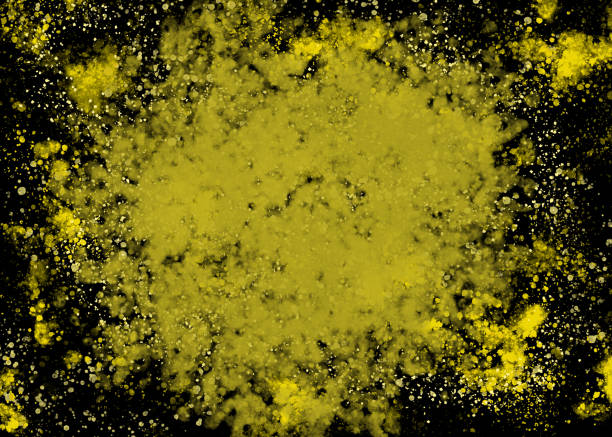 Yellow and black splatter paint stock photo