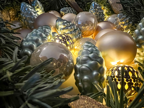 Golden Christmas decoration made of balls and light.