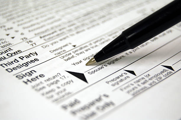 istock Signing Your Tax Return 140449031