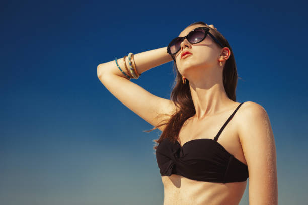 istock beautiful girl tanning 1404491685