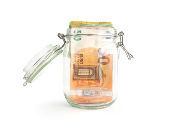 istock Euro banknotes in a glass 1404491962