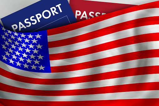 American flag background and passport of USA. Citizenship, official legal immigration, visa, business and travel concept.