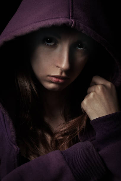 istock sad girl in hood 1404495947