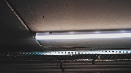 Fluorescent Discharge Lamp Installed on Ceiliing in Basement Underground Parking