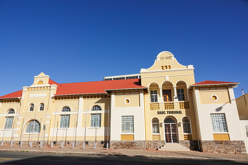 Inaugurated on 11 December 1909, Turnhalle was built as a training hall for the Windhoek Gymnastic Club by the occupying Germans in the neoclassical design, and was used by South African troops during World War I. It was used for the Turnhalle Constitutional Conference in order to thwart resistance to South African rule in 1975-1977 and later was made the base for the SADC Tribunal until it burned down in January 2007. The SADC disbanded the tribunal in 2012.