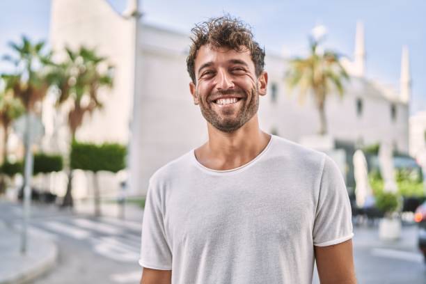 istock Young hispanic man smiling confident walking at street 1404499060
