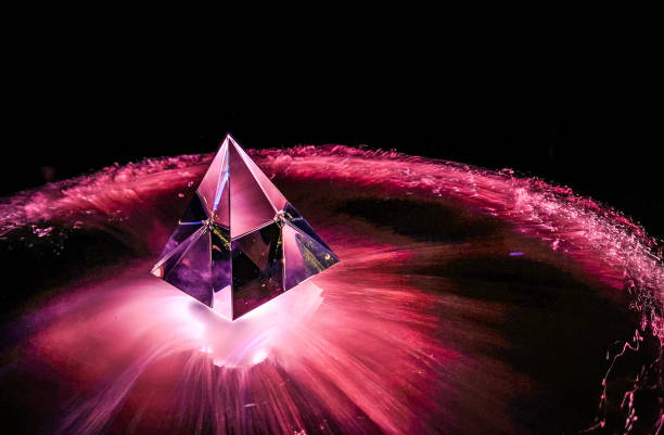 Light drawing of a crystal pyramid as a background stock photo