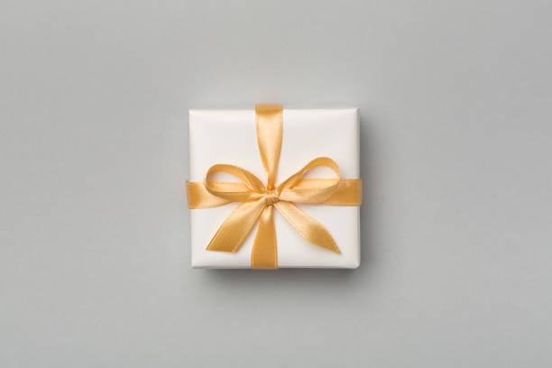 istock White gift box on color background, top view 1404499338